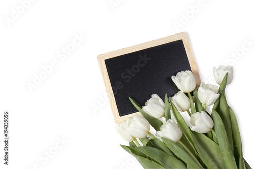 bouquet of white tulips with black board on the white background