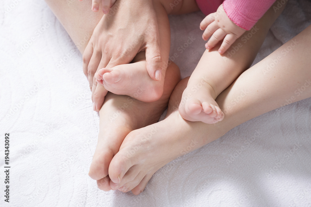 Mother take a Baby Exercise for Relief from Baby Constipation, Selective focus Mother take a Baby Exercise for Relief from Baby Constipation, Selective focus
