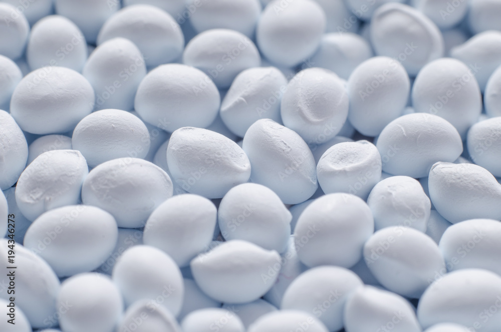 Polymer additive in granules, background texture Polymer additive in granules, background texture