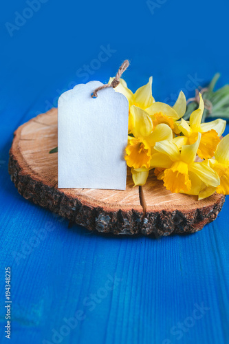 Fototapeta Naklejka Na Ścianę i Meble -  Spring easter background with daffodils bouquet on blue wooden table