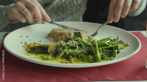 Wallpaper Mural The man eats fish and rice with vegetables in cafe. Close up Torontodigital.ca