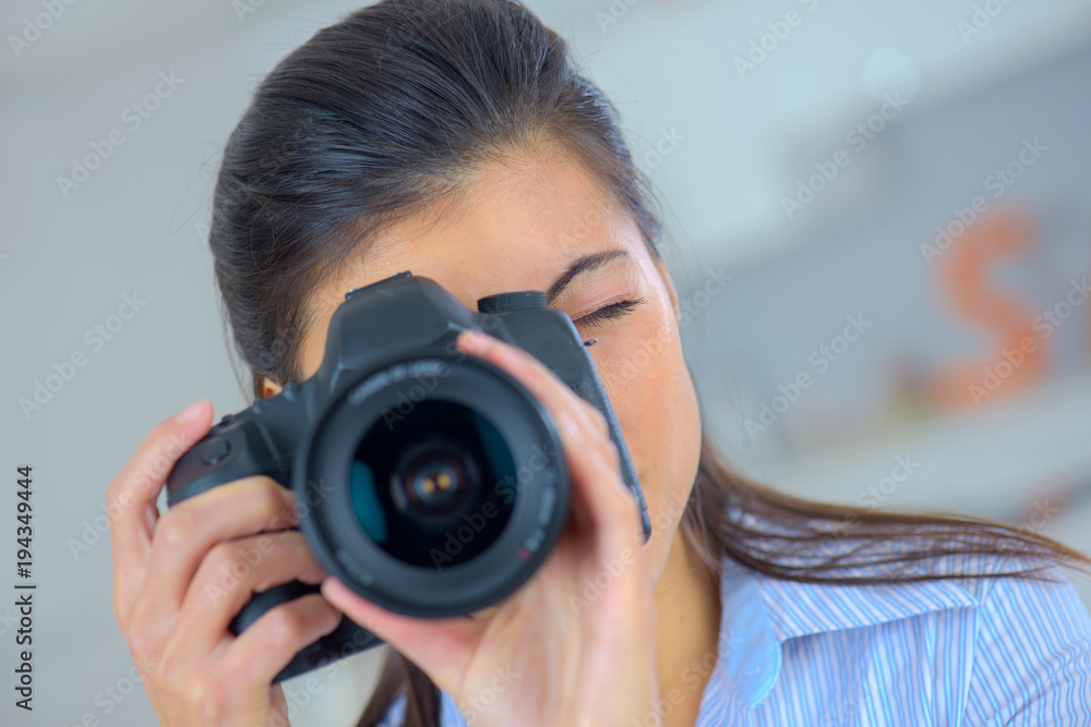 a girl taking a photo with a dslr camera a girl taking a photo with a dslr camera