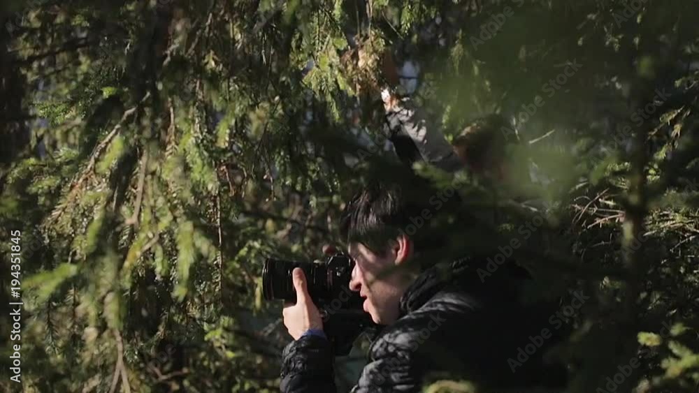 Man taking photo with professional camera Man taking photo with professional camera
