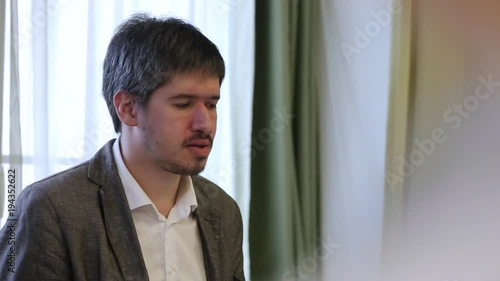 Man speaking at conference teacher photo