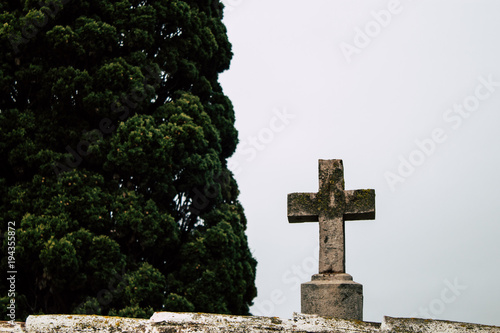 Ancient religious cross on a cloudy day.