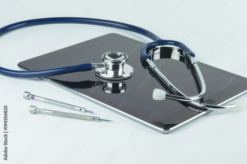 Stethoscope, tablet and screwdrivers. Stethoscope, tablet and screwdrivers.