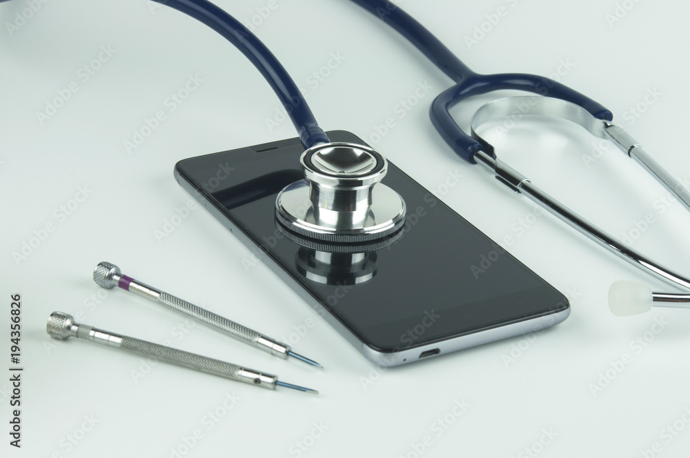 Stethoscope, smartphone and screwdrivers. Stethoscope, smartphone and screwdrivers.