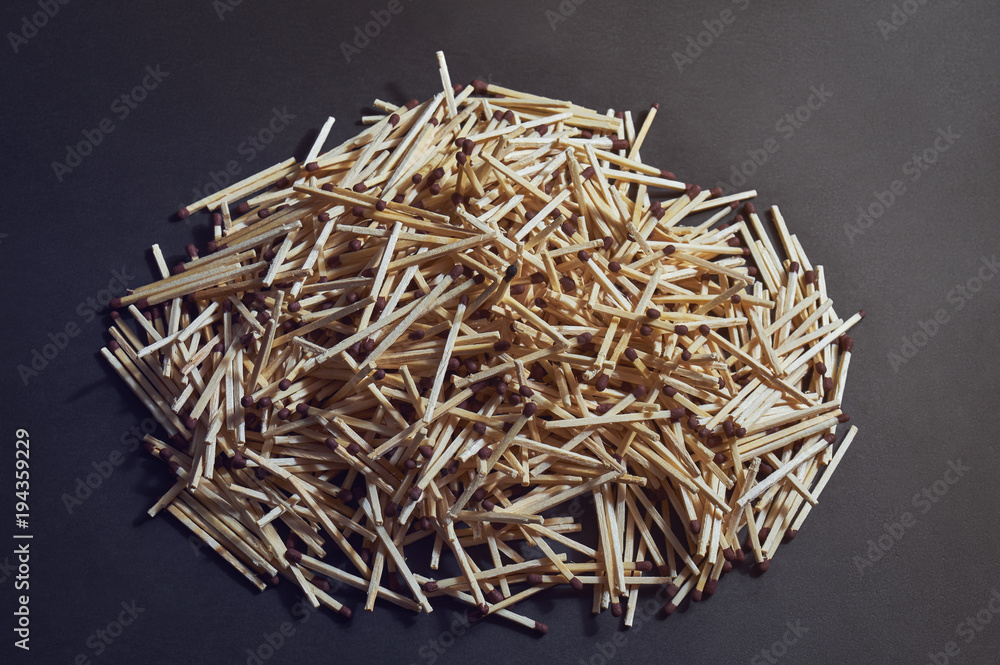 bunch of matchsticks with brown heads.