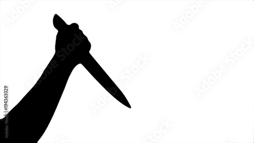 Black silhouette of a beating knife in hand on a white background photo