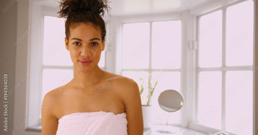Happy carefree woman smiling in bath towel Happy carefree woman smiling in bath towel