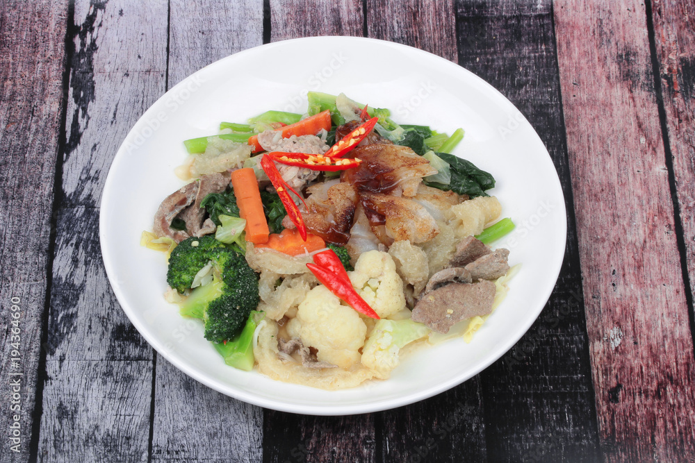 Fried big noodle with chicken and vegetables. Fried big noodle with chicken and vegetables.