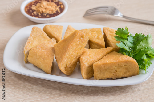 Fried tofu on plate and dip sauce