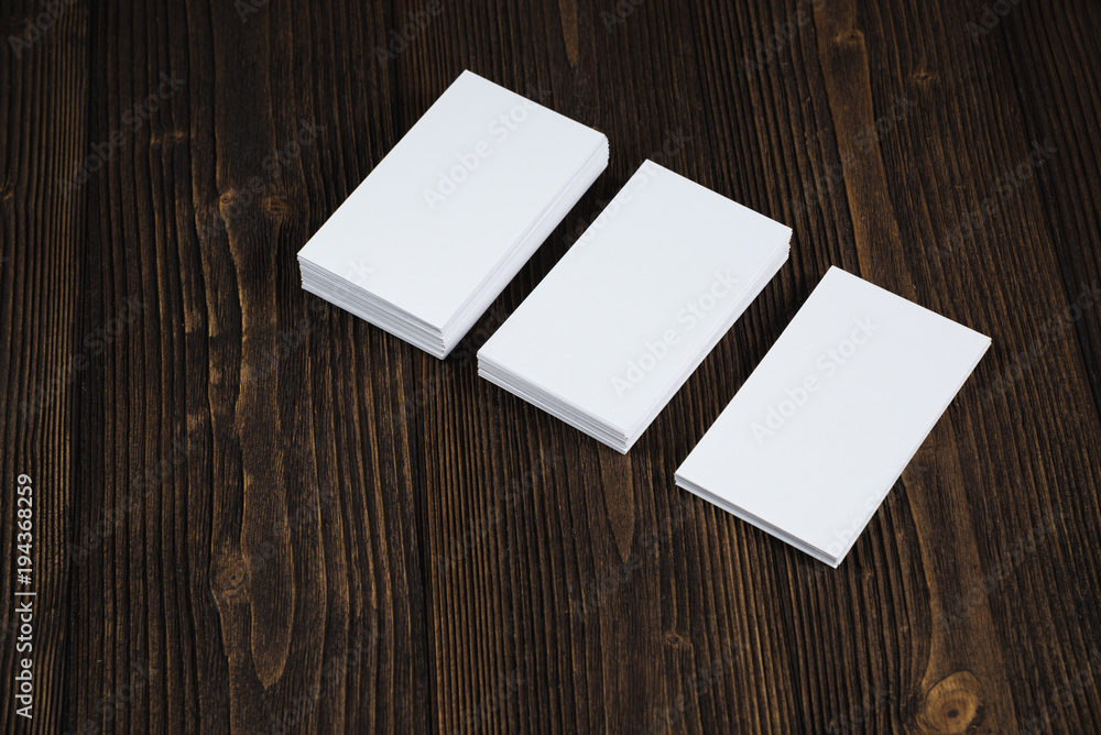 Blank business cards on wooden working table with copy space for add text ID. and logo, business company concept. Blank business cards on wooden working table with copy space for add text ID. and logo, business company concept.