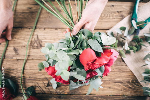 Red rose in brides flower bouquet fow wedding made by florist photo