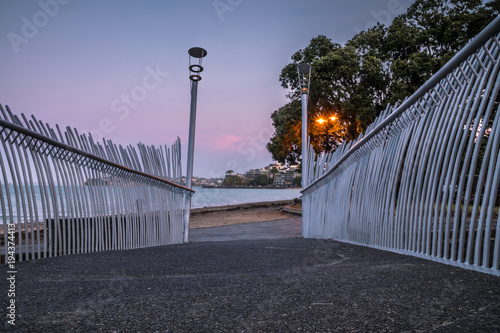View of Mission Bay Beach at Sunset through an Artistic Walking Bridge