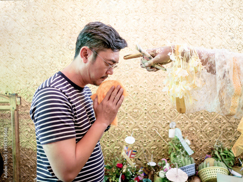 The tourist praying to Nat Bo Bo Gyi .
