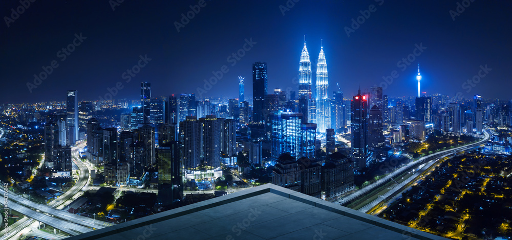 Open space balcony with Kuala Lumpur cityscape skyline view  . Night scene . - obrazy, fototapety, plakaty 