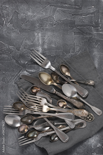 Vintage silverware on dark grey