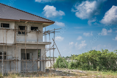 construction residential new house in progress at building site © Piman Khrutmuang
