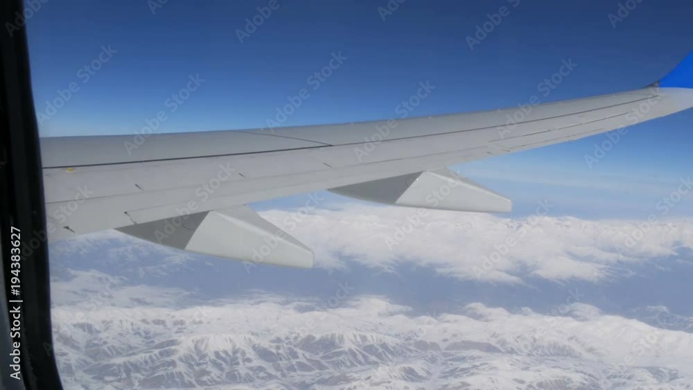 Aerial and video shooting of snow-capped Caucasian mountains from the airplane Aerial and video shooting of snow-capped Caucasian mountains from the airplane