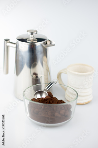 Coffee Press and Coffee Mug with Fresh Grounds