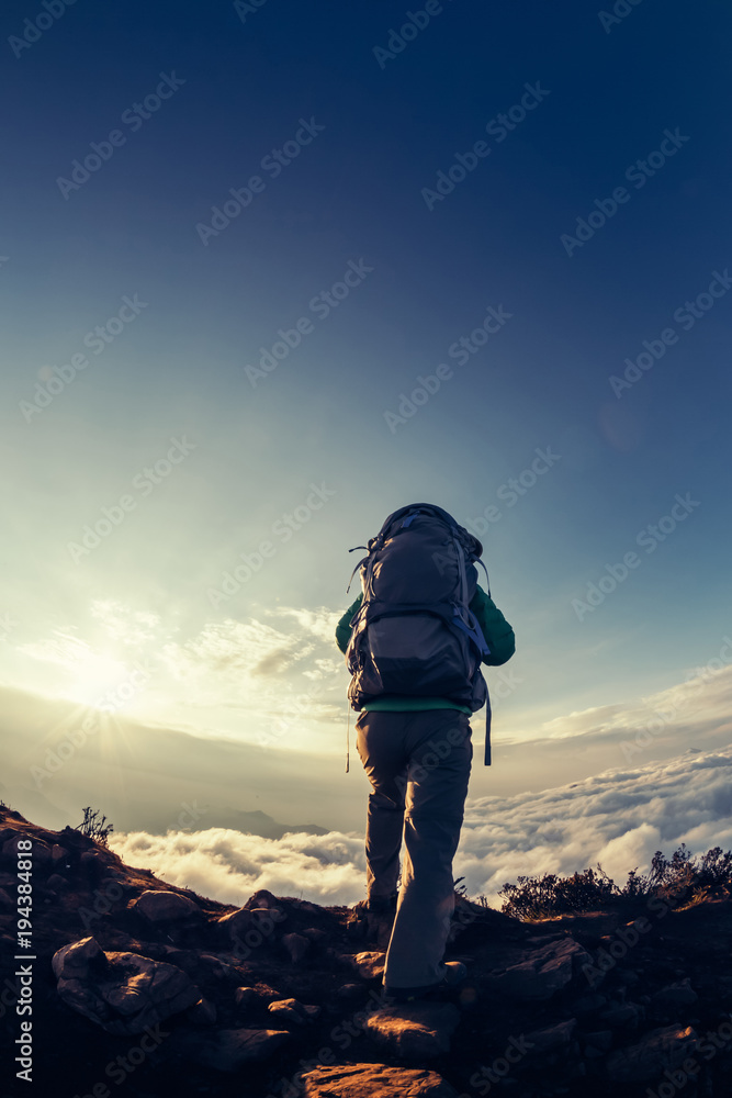 successful hiker enjoy the beautiful landscape on mountain top successful hiker enjoy the beautiful landscape on mountain top