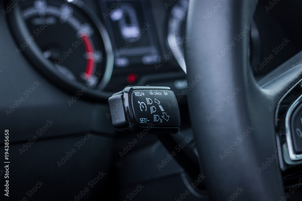 light switch on a steering wheel close up
