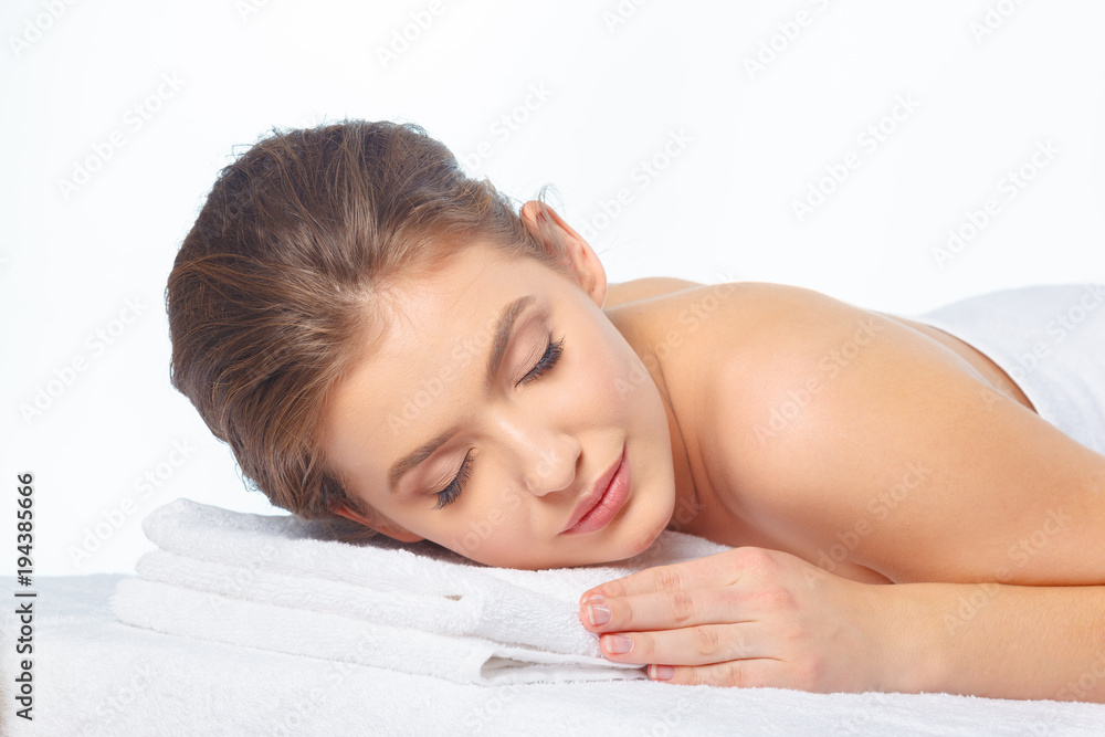 Young, beautiful and healthy woman in spa salon.