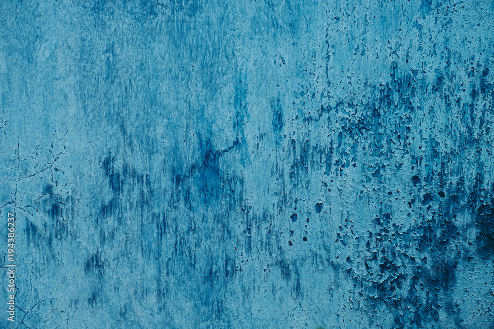 Closeup picture of an old metal painted in blue