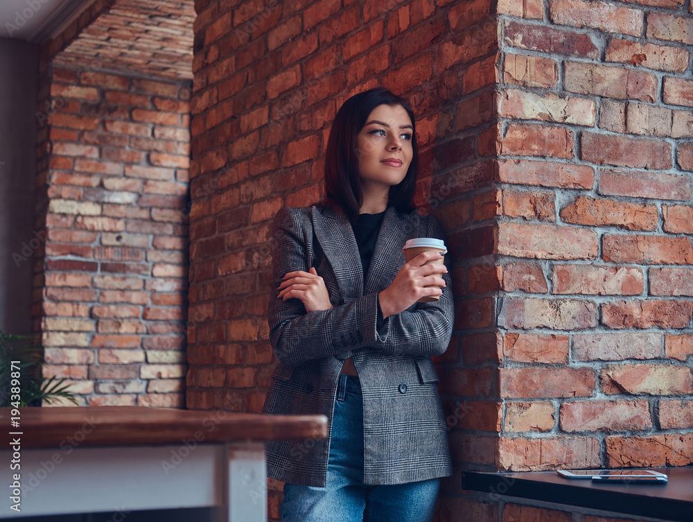 Portrait of a beauty businesswoman holds cup of a morning coffee Portrait of a beauty businesswoman holds cup of a morning coffee