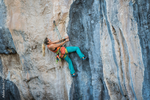 Blonde girl climbs tufa rock, Chitdibi, Turkey © Александра Голубцова