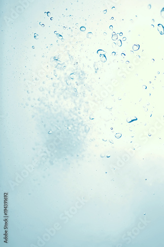 underwater air bubbles texture light blue background © kichigin19
