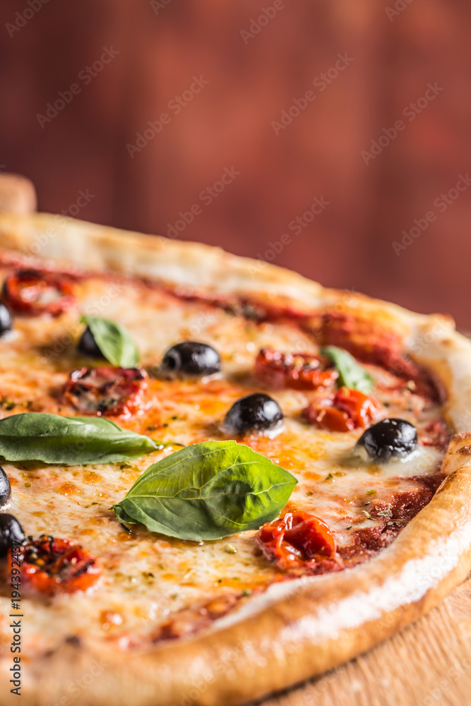 Pizza. Tasty fresh italian pizza served on old wooden table Pizza. Tasty fresh italian pizza served on old wooden table