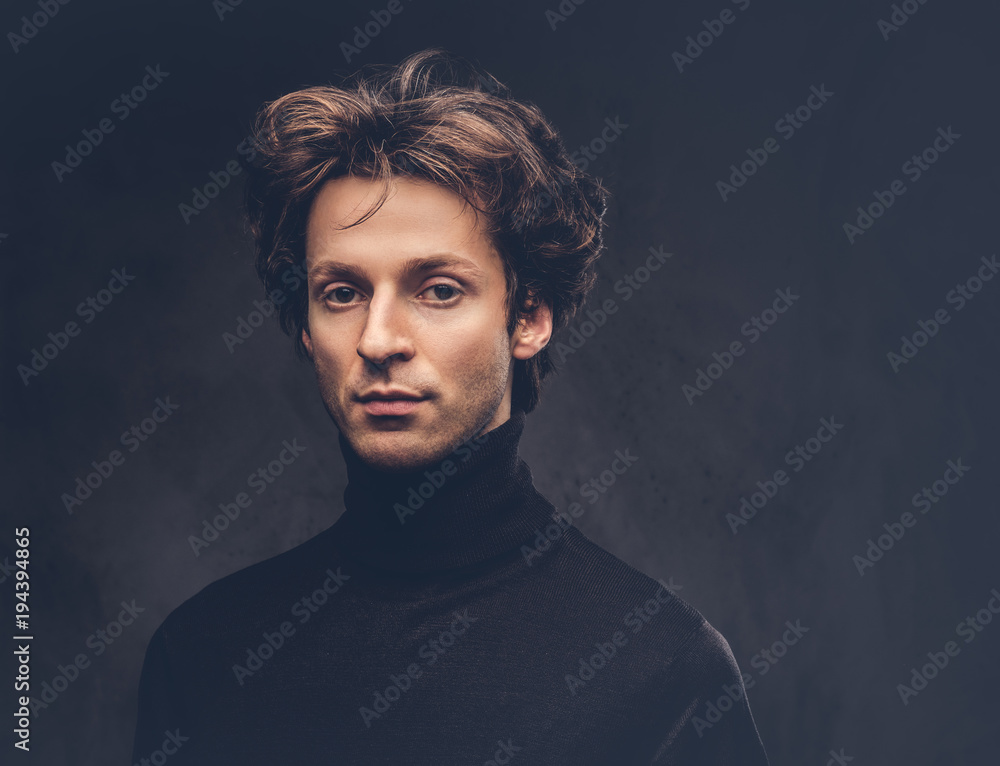 Portrait of a charismatic sensual male in black sweater. Creativ Portrait of a charismatic sensual male in black sweater. Creativ
