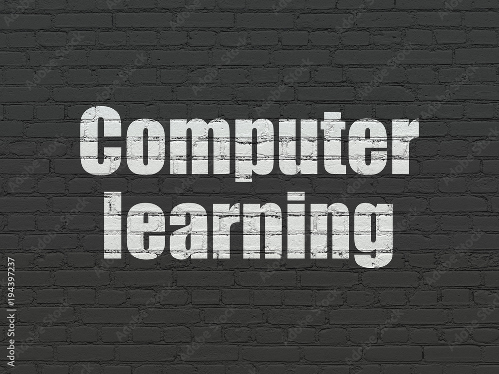 Studying concept: Painted white text Computer Learning on Black Brick wall background Studying concept: Painted white text Computer Learning on Black Brick wall background