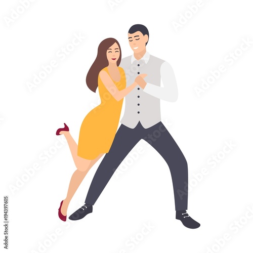 Beautiful long haired woman in yellow dress and elegantly dressed man dancing...