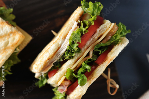 sandwich with bacon, chicken breast and lettuce