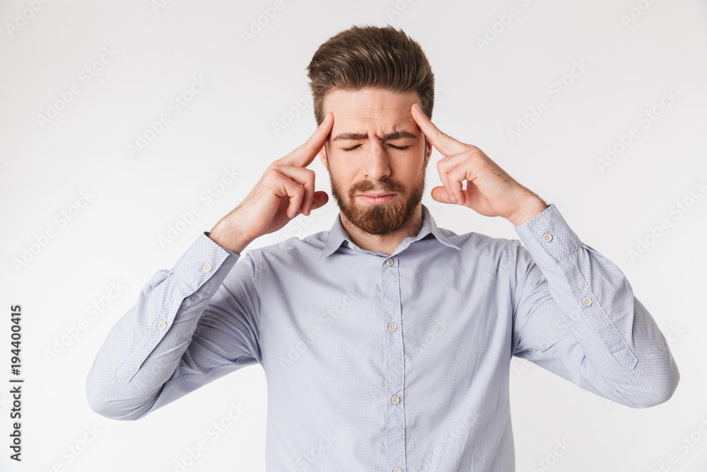 Portrait of a stressed young man dressed in shirt Portrait of a stressed young man dressed in shirt