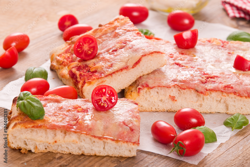 Italian pizza with cheese, tomatoes and fresh basil. Italian pizza with cheese, tomatoes and fresh basil.