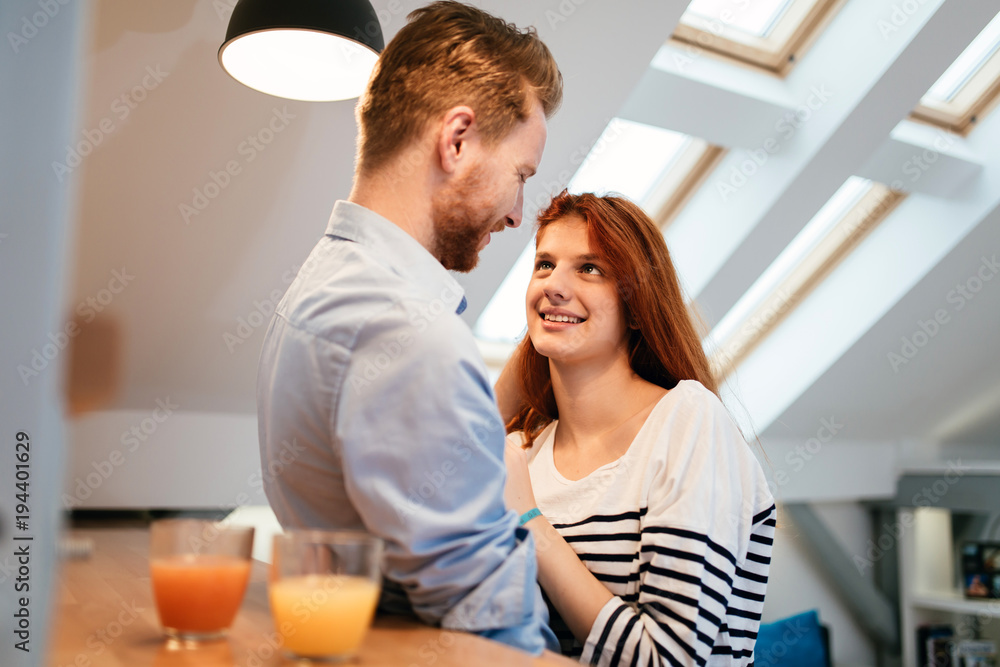 Couple in love talking smiling at home Couple in love talking smiling at home