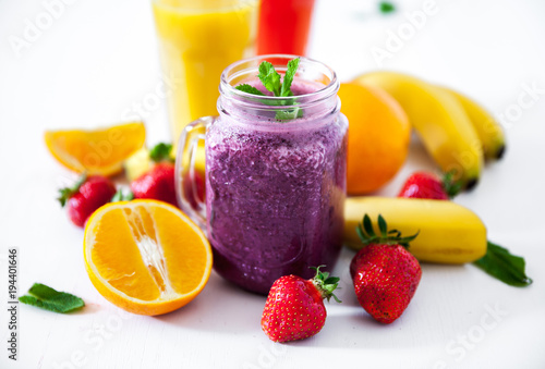 Blueberry smoothies on a white background with berries