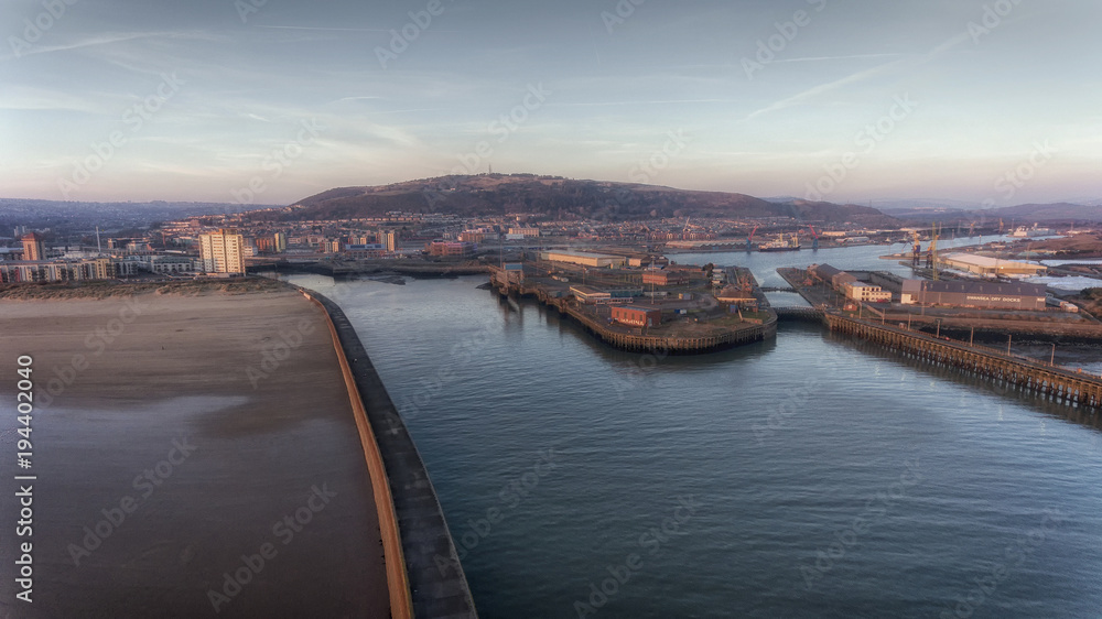 Editorial Swansea, UK - February 24, 2018: The west and east piers and mouth of the river Tawe at the entrance to the docks at Swansea city UK