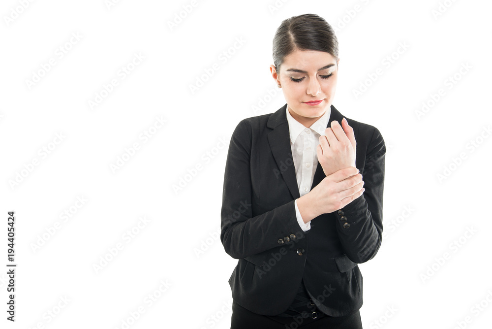 Portrait of beautiful female holding her wrist like hurting Portrait of beautiful female holding her wrist like hurting