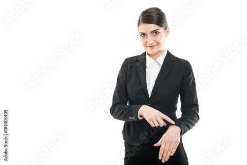 Beautiful female flight attendant showing late gesture