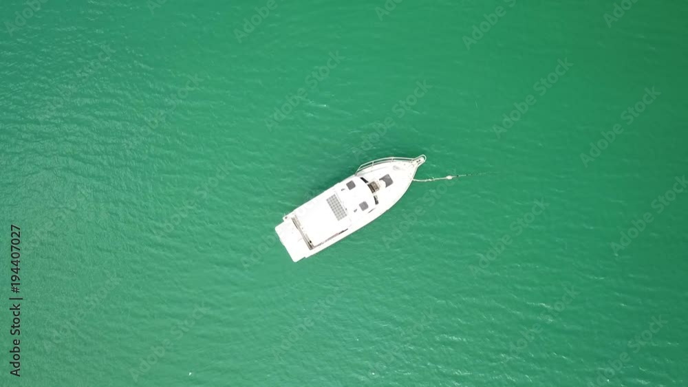 aerial view of white yacht floating over blue sea aerial view of white yacht floating over blue sea