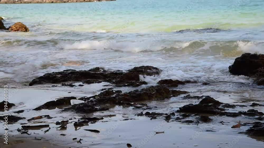 Sea waves over sand beach