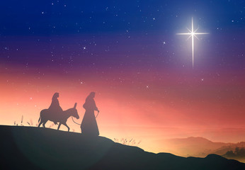 Conceptual nativity scene silhouette of Joseph and Mary with donkey under a star-shaped cross, symbol of redemption and hope