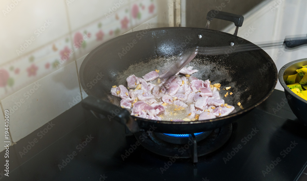 Stir and fry the pork is done in the kitchen. In order to cook Stir Fried pumpkin with pork.Which contains ingredients such as vegetables and meat. Food of Thailand people like to eat. Stir and fry the pork is done in the kitchen. In order to cook Stir Fried pumpkin with pork.Which contains ingredients such as vegetables and meat. Food of Thailand people like to eat.