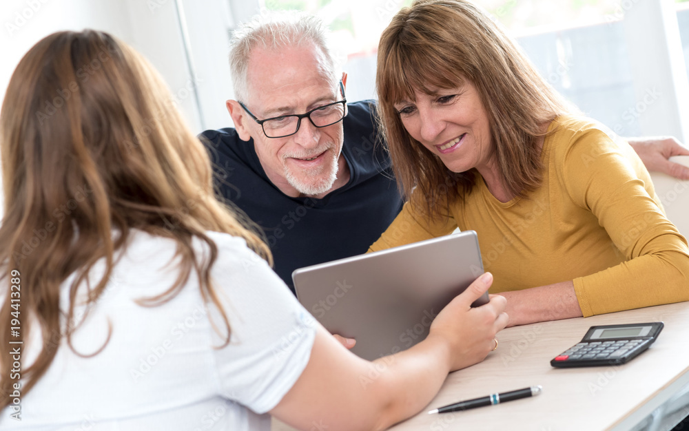 Senior couple meeting real estate agent Senior couple meeting real estate agent