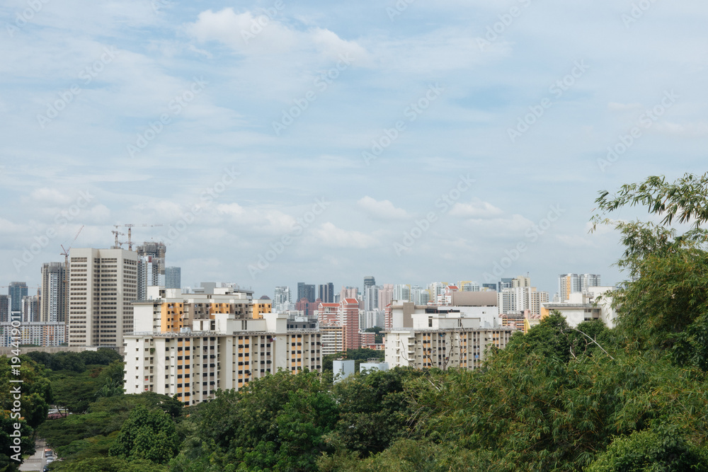 Modern city and green forest in spring day